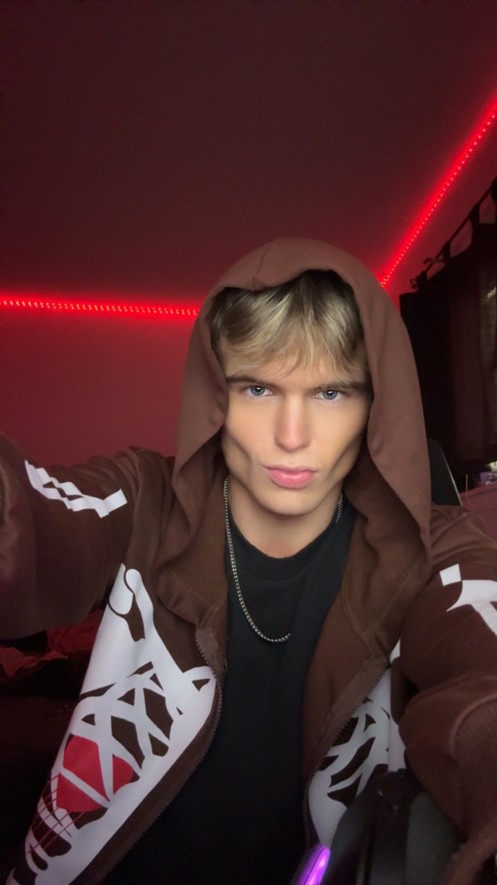 Portrait wearing a brown graphic hoodie